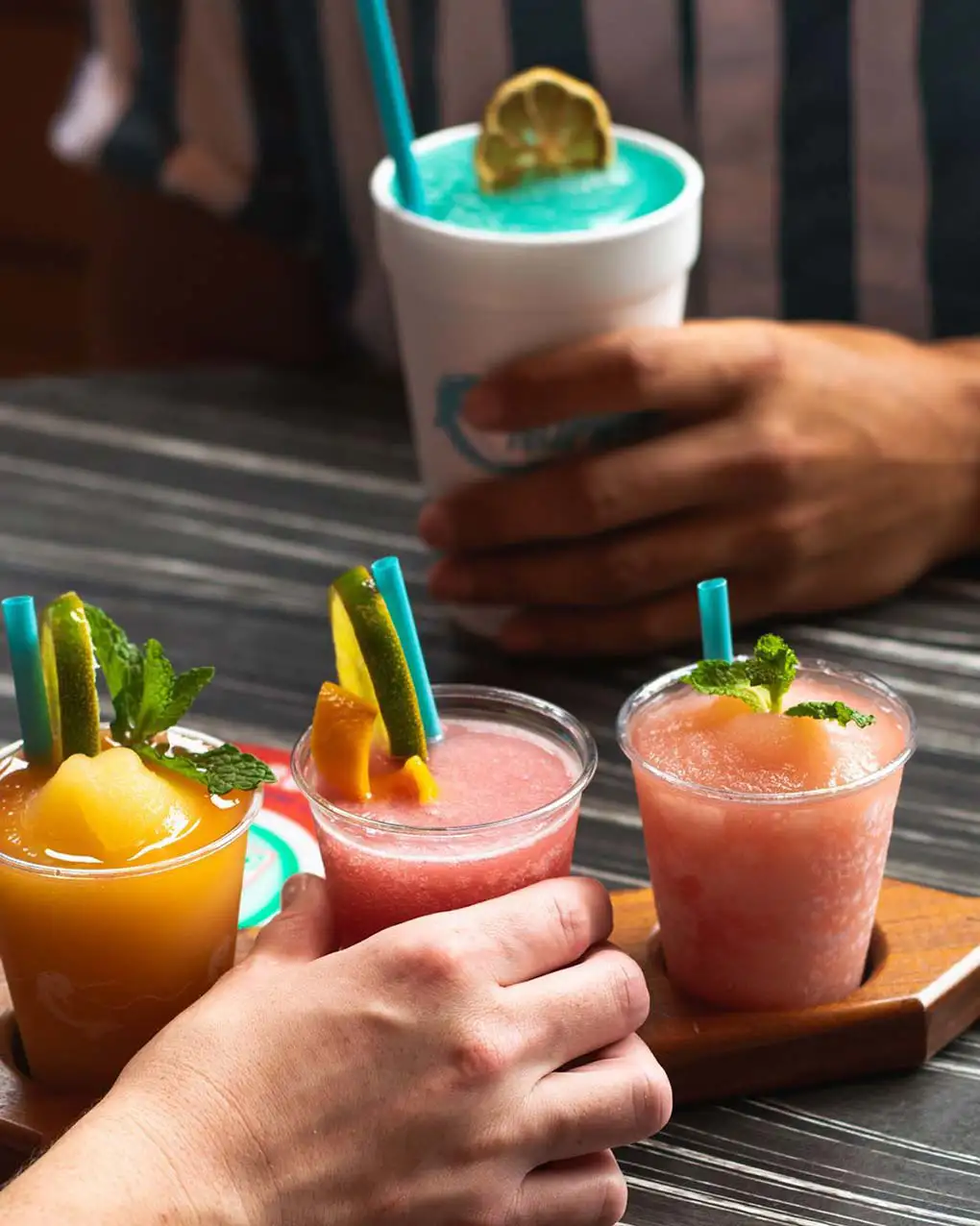 Customers at table with flight and drink